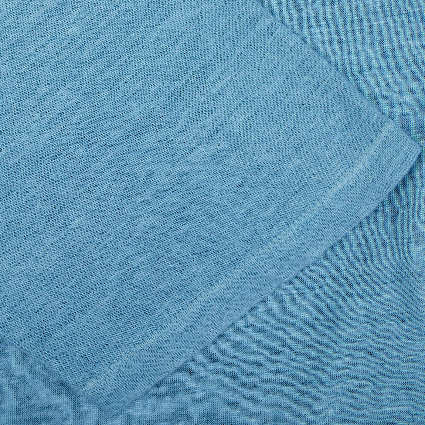 Aqua Blue Linen Polo Shirt from Massimo Alba, with a folded corner, dyed using natural chemical-free pigments.
