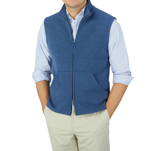 A man wearing a Maurizio Baldassari Denim Blue Milano Stitch Wool Zip Gilet and tan pants.