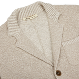 A Maurizio Baldassari Beige Melange Cotton Mouline slim fit knitted jacket with a button down collar.