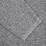 A close up image of a Maurizio Baldassari Blue Melange Cotton Mouline Knitted Jacket.