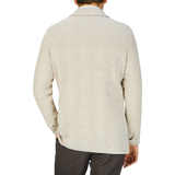 The back view of a man wearing a Maurizio Baldassari Brown Herringbone Silk Cotton Linen Swacket in beige.