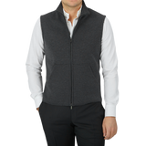 A man wearing a Charcoal Grey Maurizio Baldassari Milano Stitch Wool Zip Gilet and a black shirt.