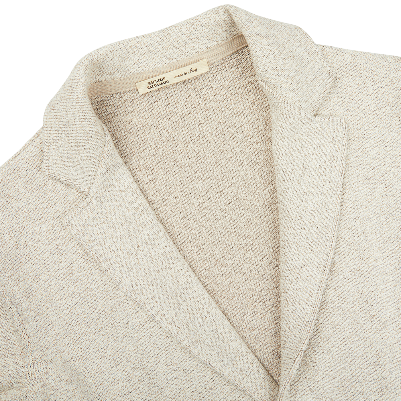 A close up of a Light Brown Cotton Mouline Swacket by Maurizio Baldassari on a white surface.