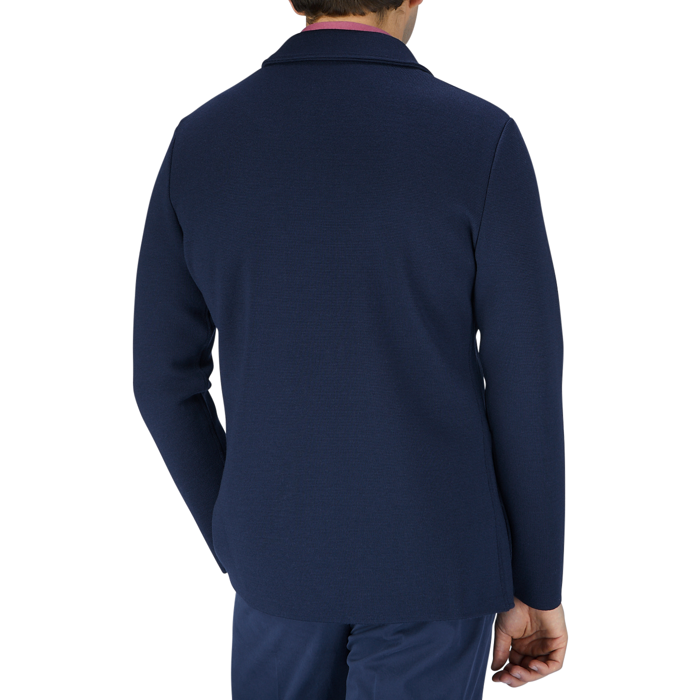The back view of a man wearing a Maurizio Baldassari Navy Blue Merino Wool Milano Stitch Swacket and pants crafted from merino wool.