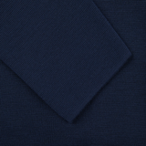 A close up of a Maurizio Baldassari Navy Blue Merino Wool Milano Stitch Swacket.