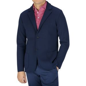 A man wearing a Maurizio Baldassari navy blue Merino Wool Milano Stitch Swacket and pink pants.