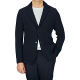 A man wearing a Maurizio Baldassari Navy Blue Organic Cotton Rib Stitched Swacket and pants.