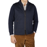 Maurizio Baldassari wearing a Navy Water Repellent Pure Cashmere Gilet and brown pants.
