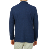 The back view of a man wearing a Maurizio Baldassari Dark Blue Wool Linen Silk Jersey Blazer.