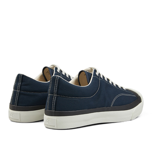 A pair of navy blue Moonstar Nylon Gym Court sneakers with white vulcanized soles and lace-up fronts.