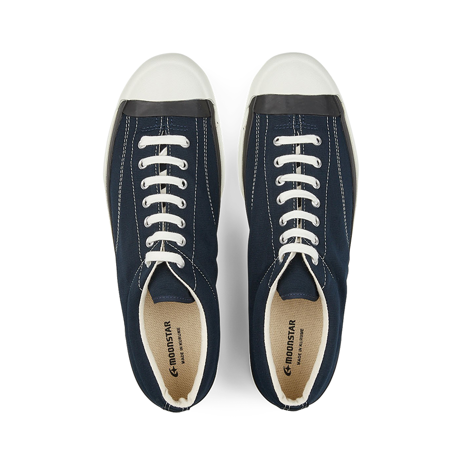 A pair of Moonstar navy blue nylon gym court sneakers with white vulcanized soles and laces.
