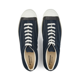 A pair of Moonstar navy blue nylon gym court sneakers with white vulcanized soles and laces.
