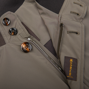 Close-up of a luxurious Olive Green Technical Nylon Blouson jacket with zipper detail and buttons, featuring a Moorer label.