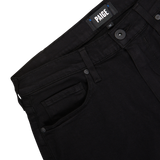 A close-up of a black pair of Regular Fit Jeans with a visible brand label "Paige" on the waistband.