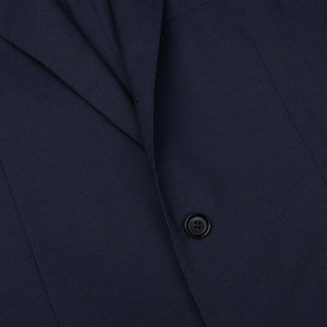 A close up of a Ring Jacket Navy High Twist Wool Suit with buttons.