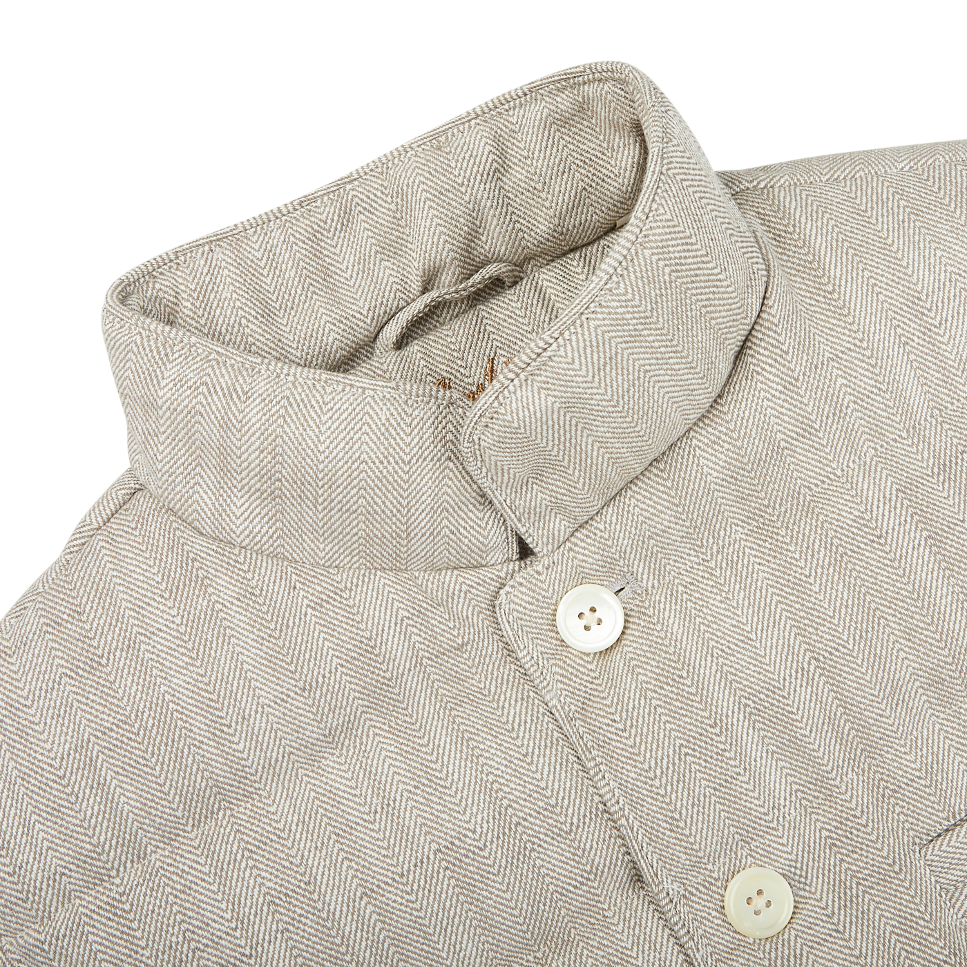 A beige linen jacket with front buttons, ideal for layering or as a lightweight outerwear option by Stenströms.