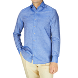 A man in a Stenströms Blue Melange Cotton Linen Slimline Shirt and tan pants.