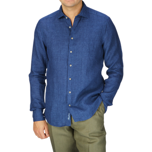 A man in a Dark Blue Linen Fitted Body Shirt by Stenströms and khaki pants, summer essential.