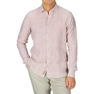 A man in a Stenströms Dark Orange Striped Linen Slimline Shirt.