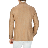 The back view of a man wearing a Studio 73 Camel Brown Herringbone Pure Silk Blazer.