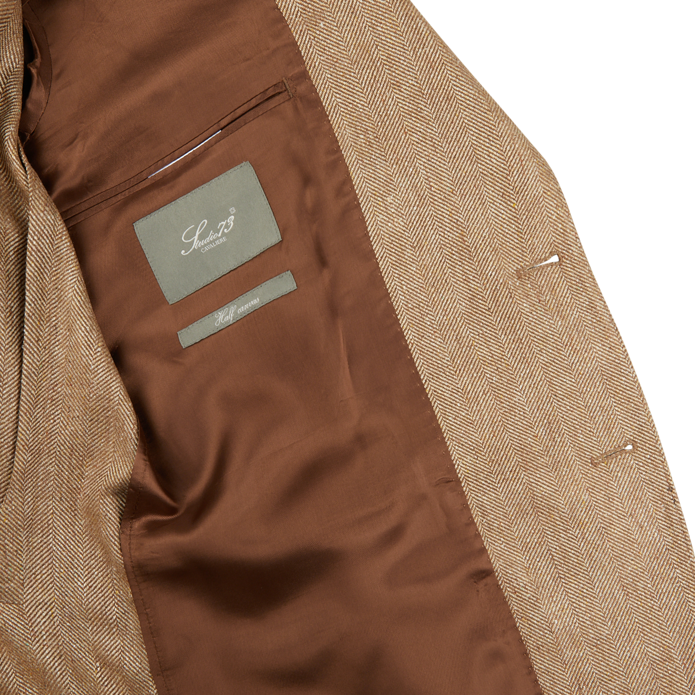 The back of a Studio 73 Camel Brown Herringbone Pure Silk Blazer with a label on it.