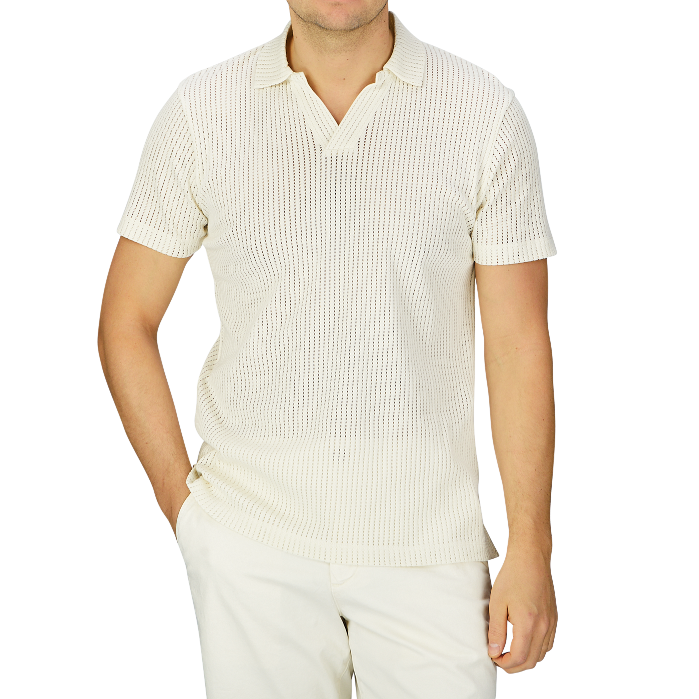 A man wearing a Sunspel Ecru White Linear Cotton Mesh Polo Shirt made of Supima cotton and pants.