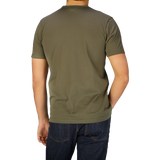 A man wearing a Khaki Green Classic Cotton T-shirt by Sunspel.
