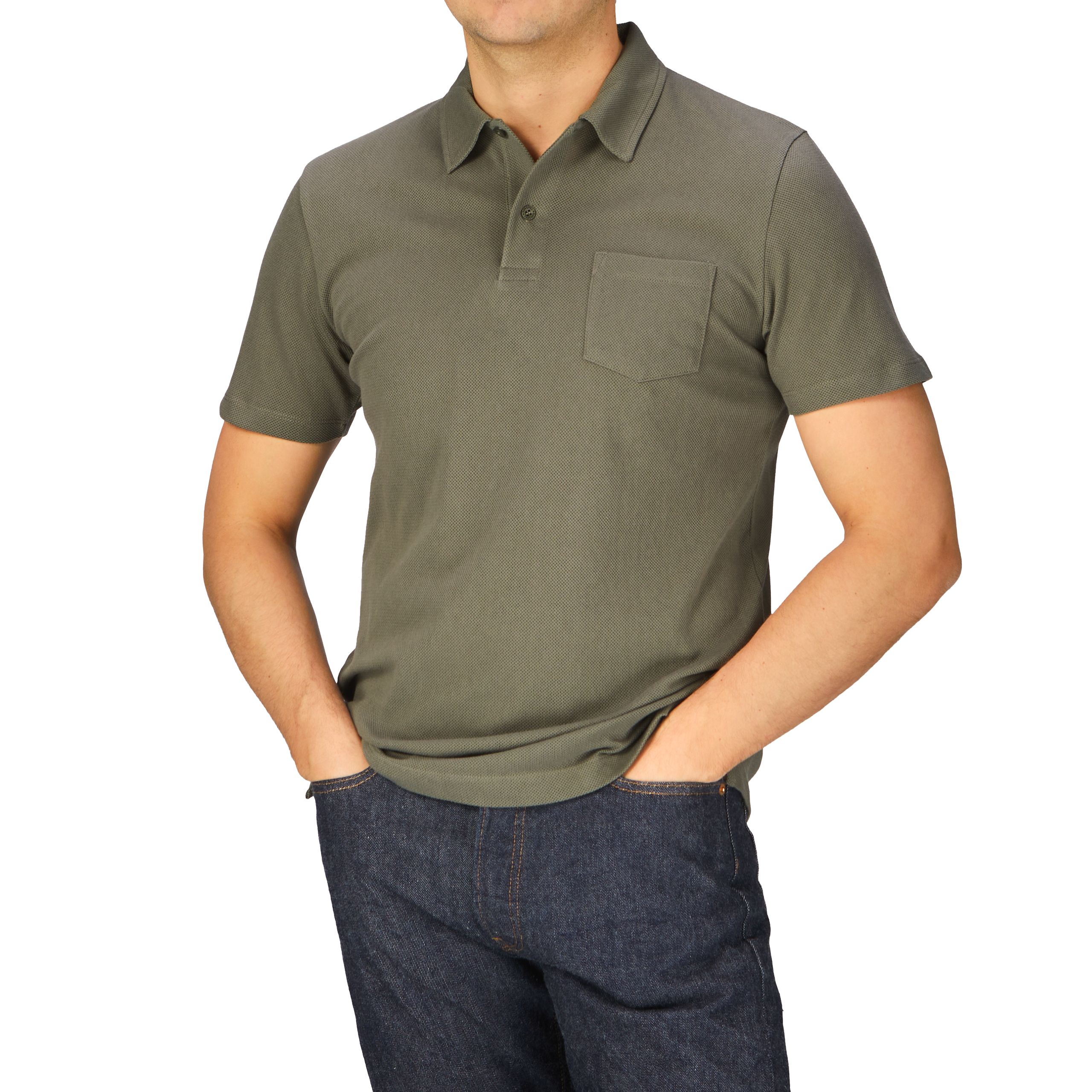 A man wearing a Khaki Green Cotton Riviera Polo Shirt by Sunspel and jeans.
