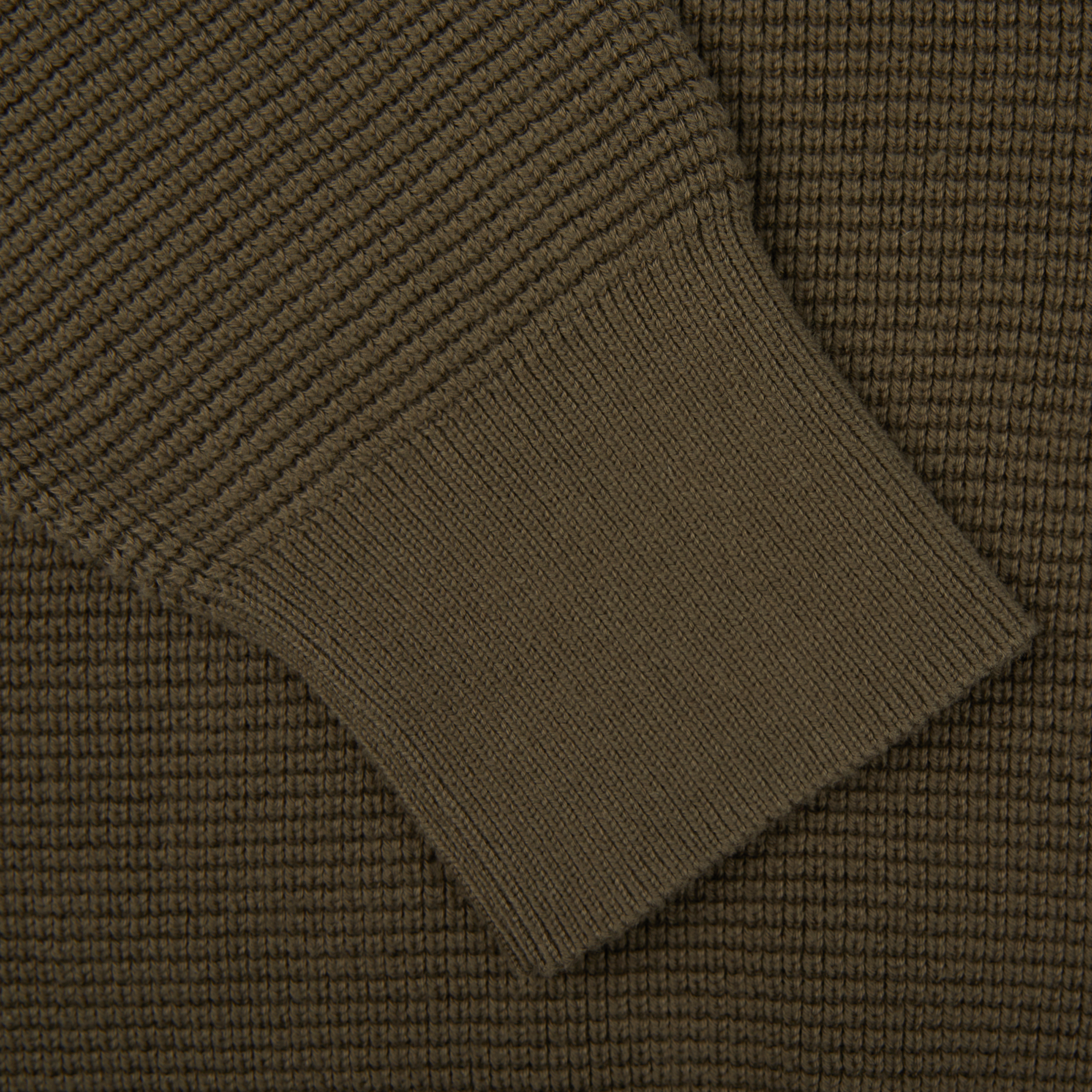 A close up of a Khaki Green Cotton Waffle Stitch Crew Neck sweater by Sunspel.