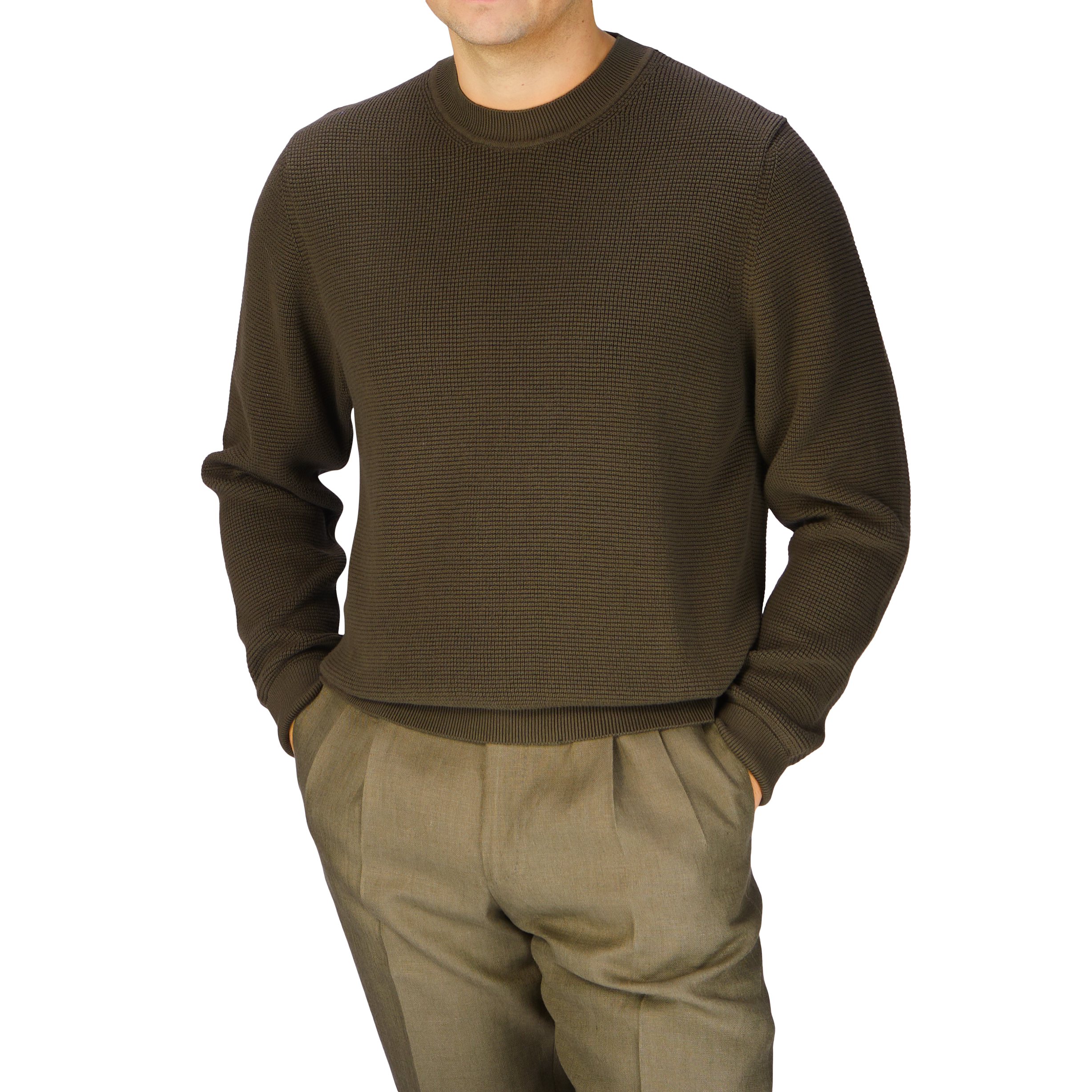 A man wearing a Khaki Green Cotton Waffle Stitch Crew Neck sweater and pants by Sunspel.
