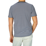 The man is seen wearing a comfortable Navy White Striped Classic Cotton T-Shirt from Sunspel.