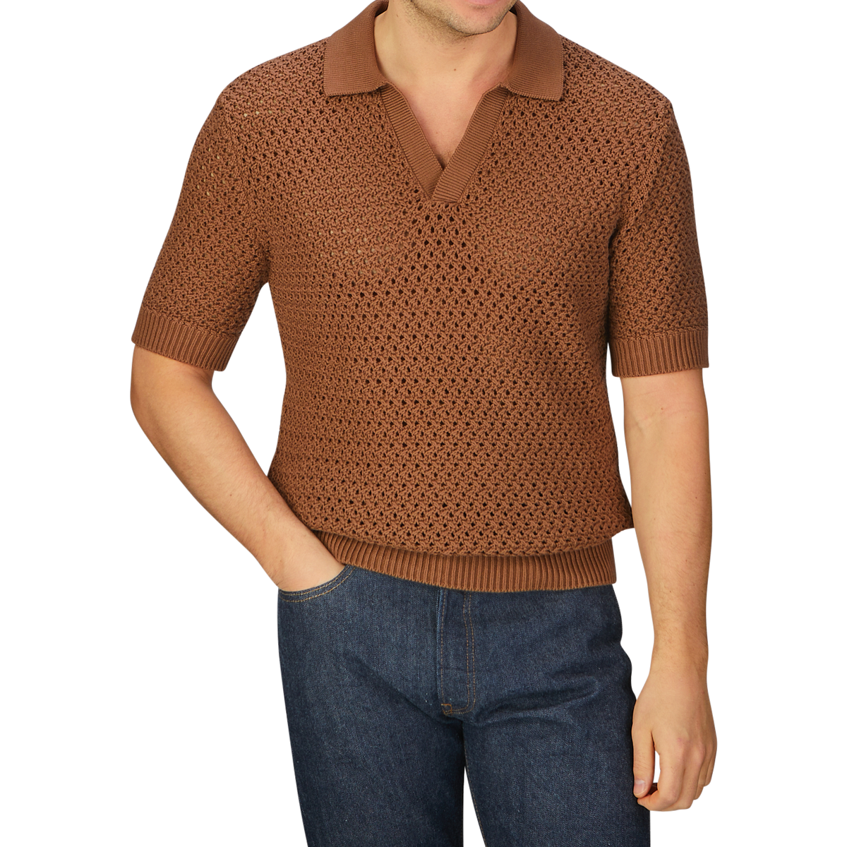 A man wearing a luxurious Sunspel Nougat Brown Cotton Chunky Knit Polo Shirt.