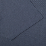 A close up of a slate blue Sunspel Riviera Polo Shirt.