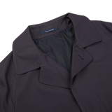 A Tagliatore navy blue cotton nylon trench coat with a slim fit and black collar.