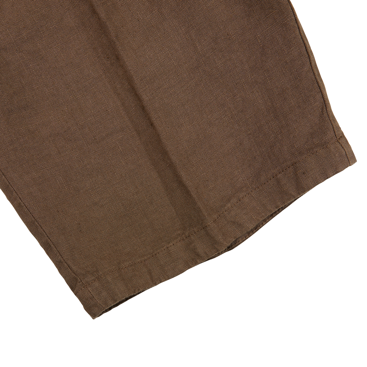 A close up of Tela Genova's Brown Linen Damasco Pleated Shorts.