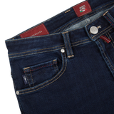 A pair of Dark Blue Leonardo 1 Month Jeans by Tramarossa with a red label, made from Japanese denim.