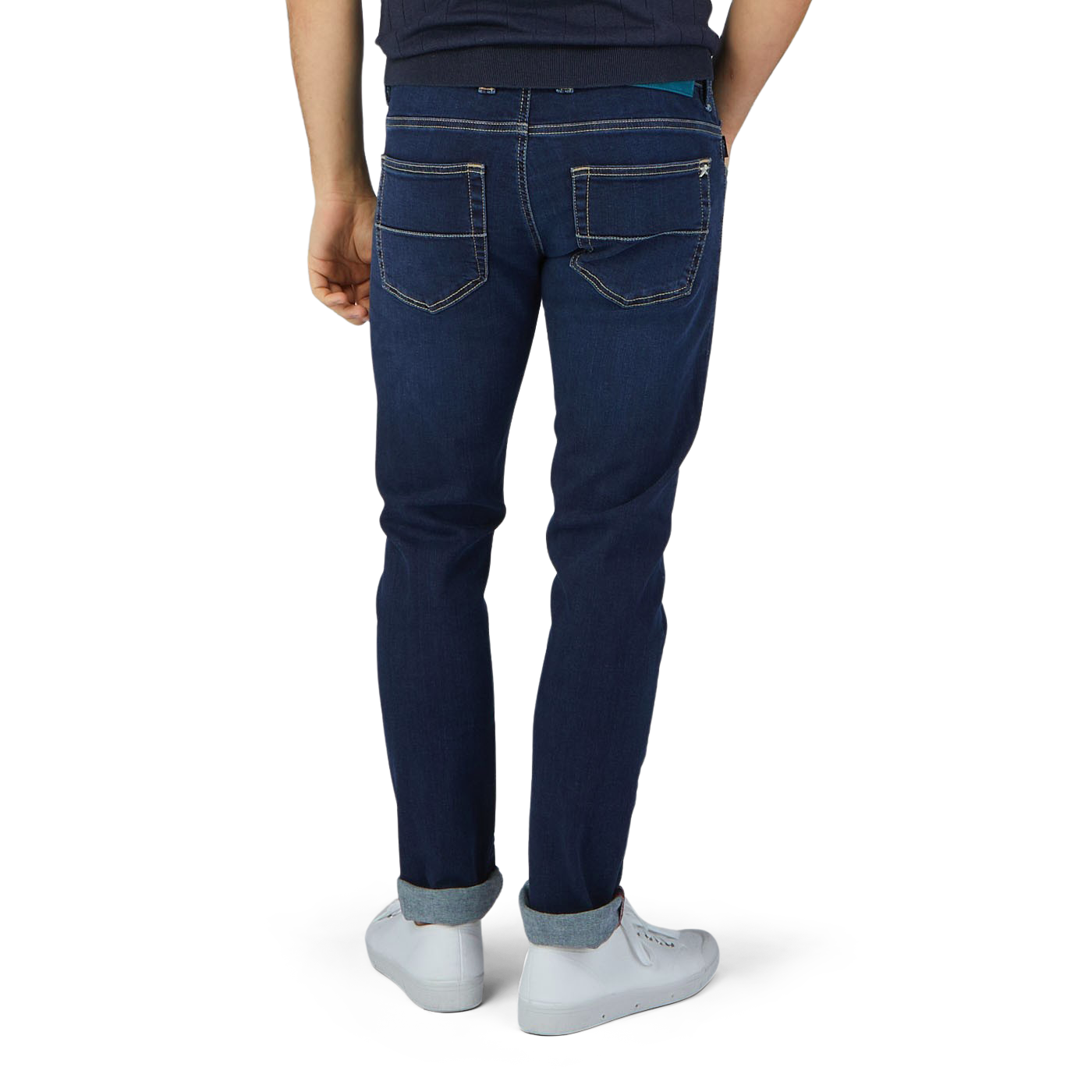 The man is wearing comfortable Dark Blue Leonardo 1 Month Jeans by Tramarossa and a white t-shirt as seen from the back.