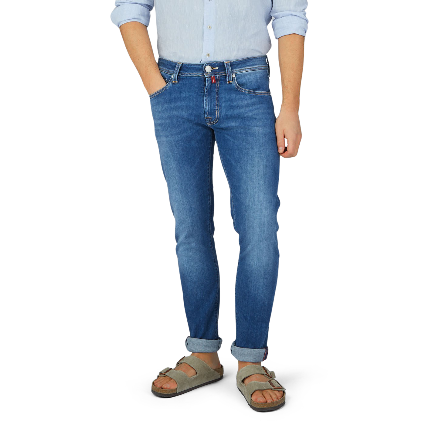 A man in Tramarossa Washed Blue Leonardo 6 Months Jeans and sandals for comfort.