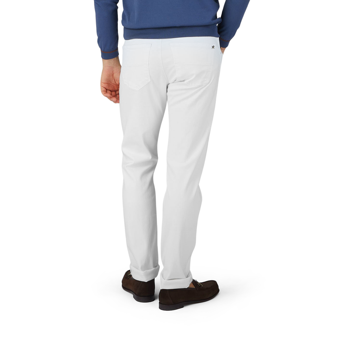 A man in White Super Stretch Michelangelo Jeans and a blue sweater by Tramarossa.