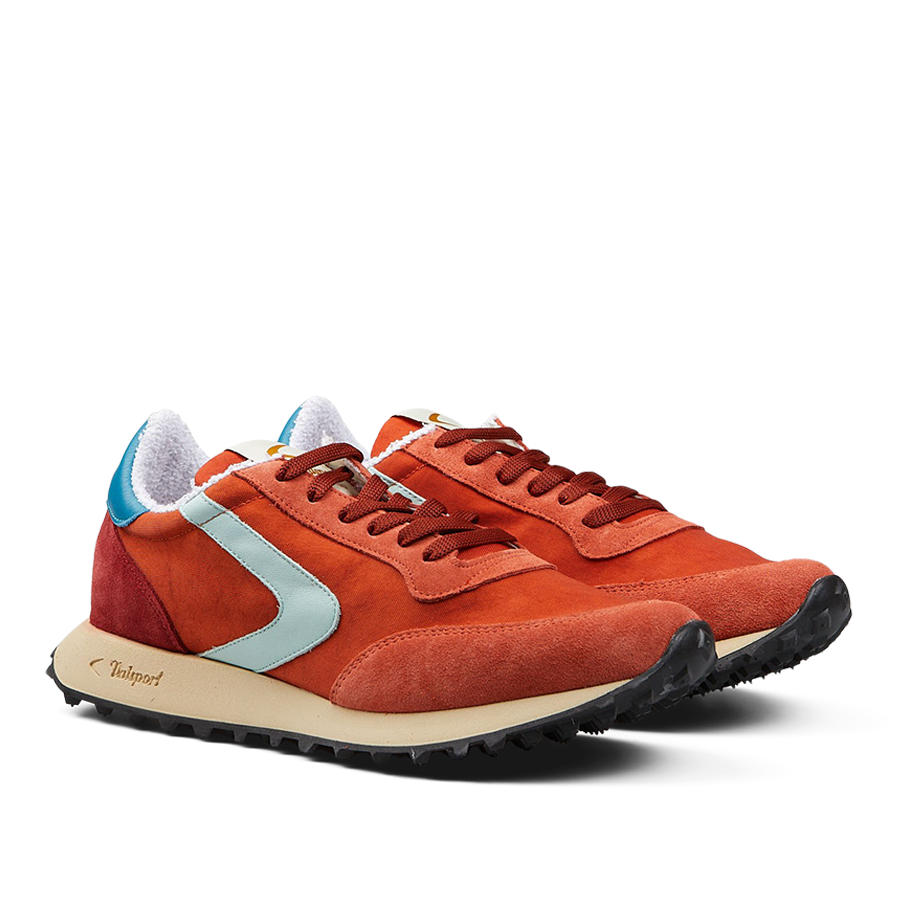 A pair of Valsport Bright Orange Nylon Suede Heritage sneakers with light blue accents and beige soles.