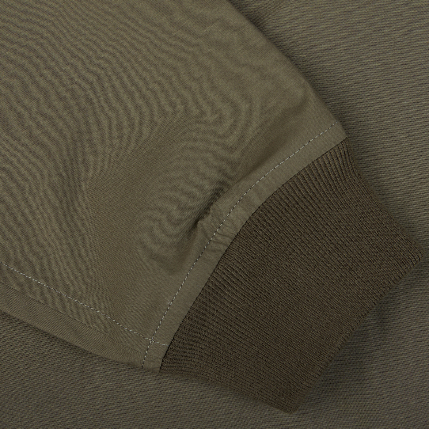 Close-up of an olive green Olive Green Cotton Ripstop Valstarino jacket with ribbed cuff detail.