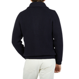 The back view of a man wearing a William Lockie Navy Blue Cashmere Shawl Collar Cardigan.