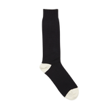 A single Navy Blue Cotton Contrast Cable-Knit Sock with white toes and heel, displayed against a white background, made by William Lockie.