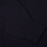 A close up image of a Navy Lambswool Saddle Shoulder Cardigan made by William Lockie.