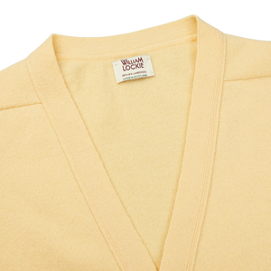 This regular fit, Solar Yellow Lambswool Saddle Shoulder Cardigan is crafted from Scottish lambswool, made by William Lockie.