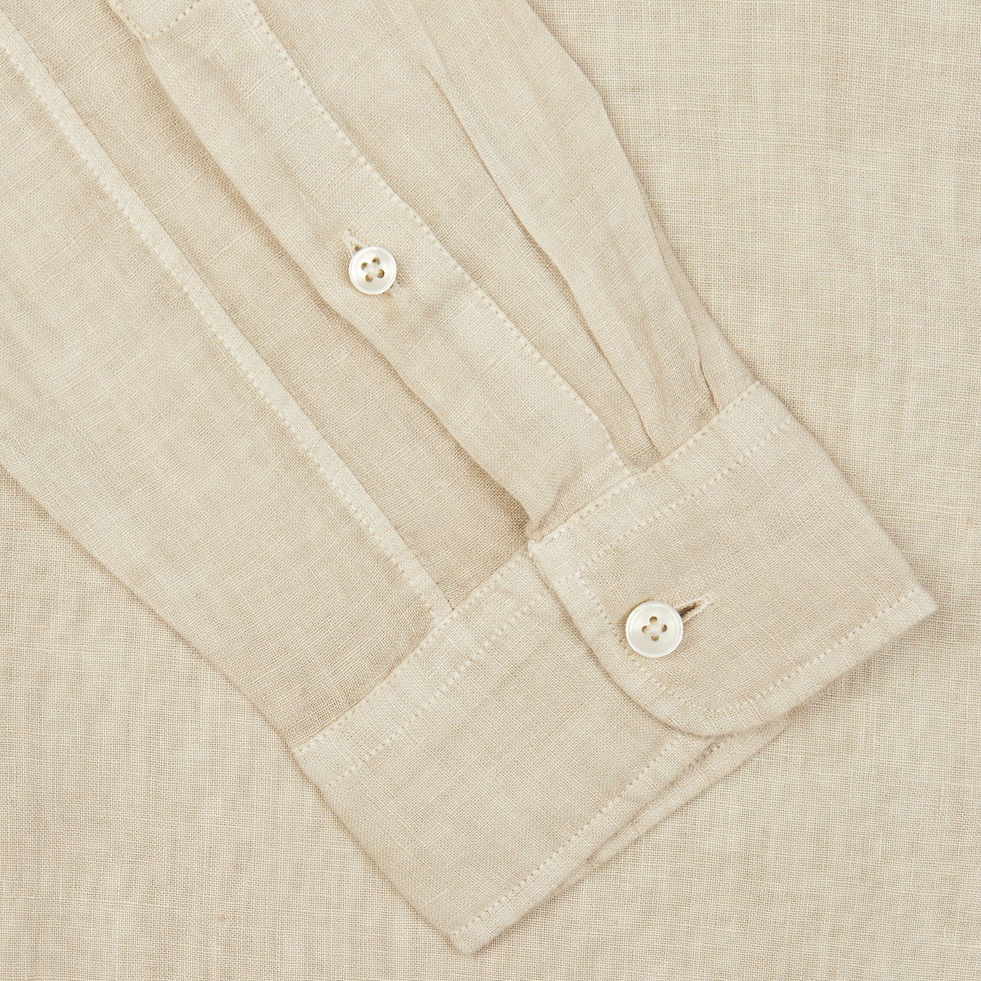 Close-up of a Light Beige Washed Linen Legacy Shirt sleeve by Xacus with buttoned cuff.