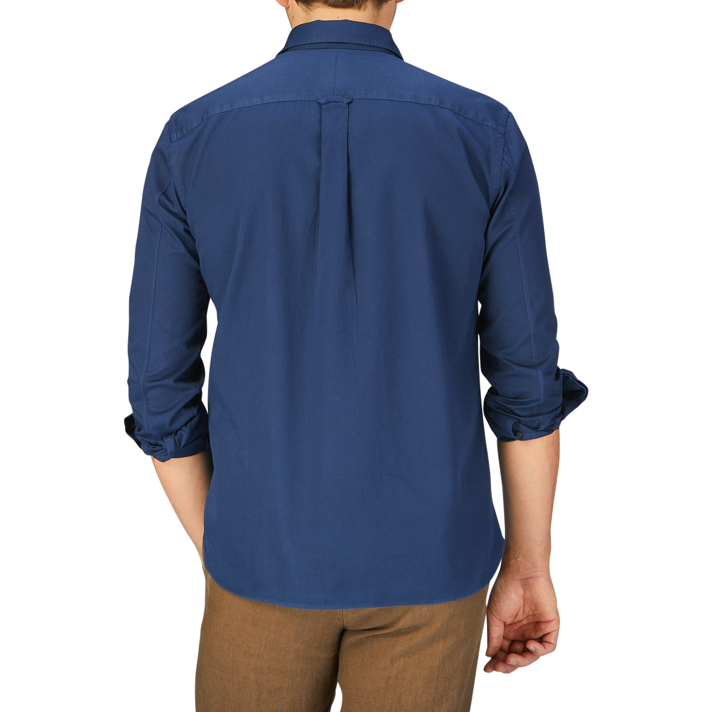 A man viewed from behind wearing a Navy Washed Cotton Twill Legacy Shirt by Xacus and khaki trousers.