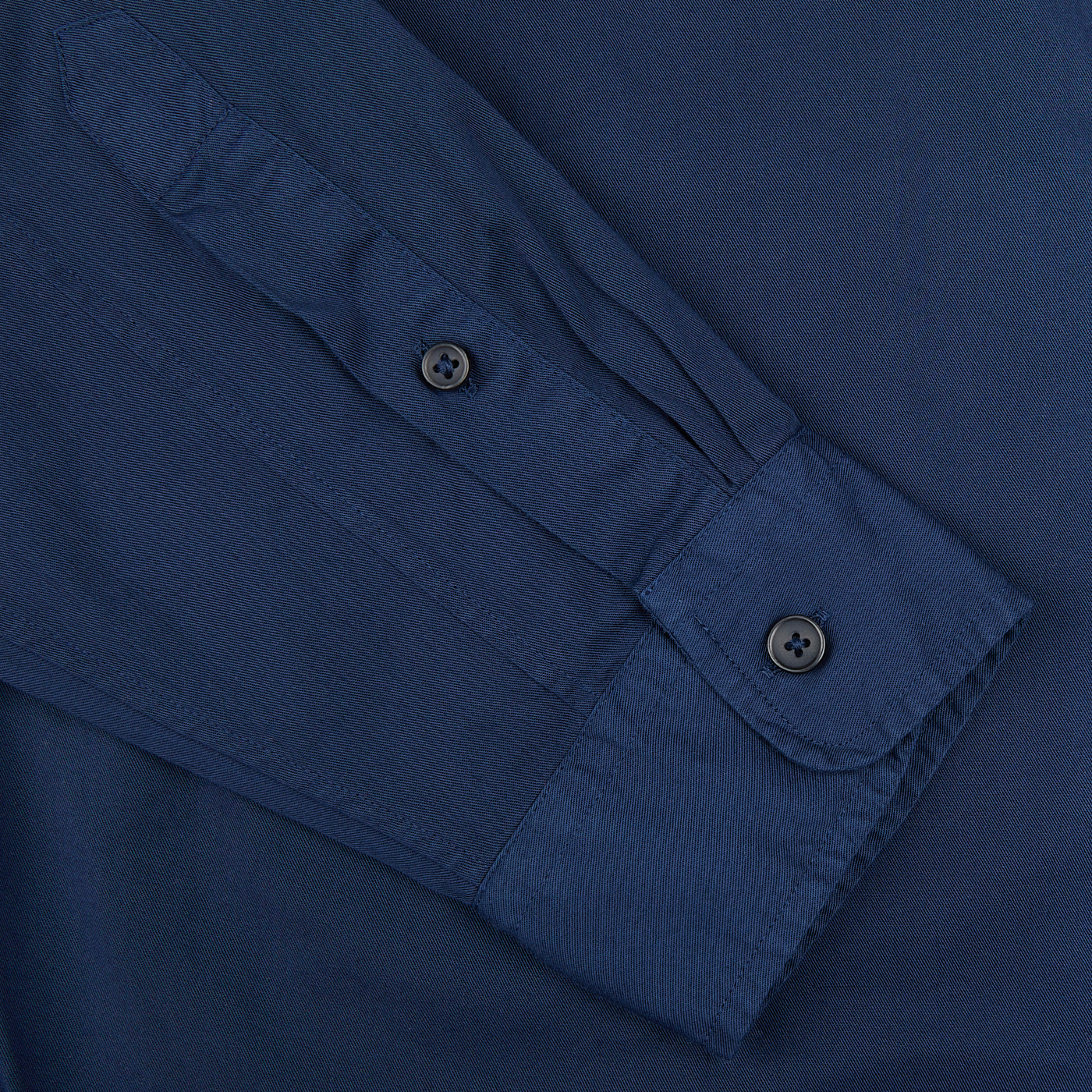 Close-up of a Xacus Navy Washed Cotton Twill Legacy Shirt cuff with buttons.