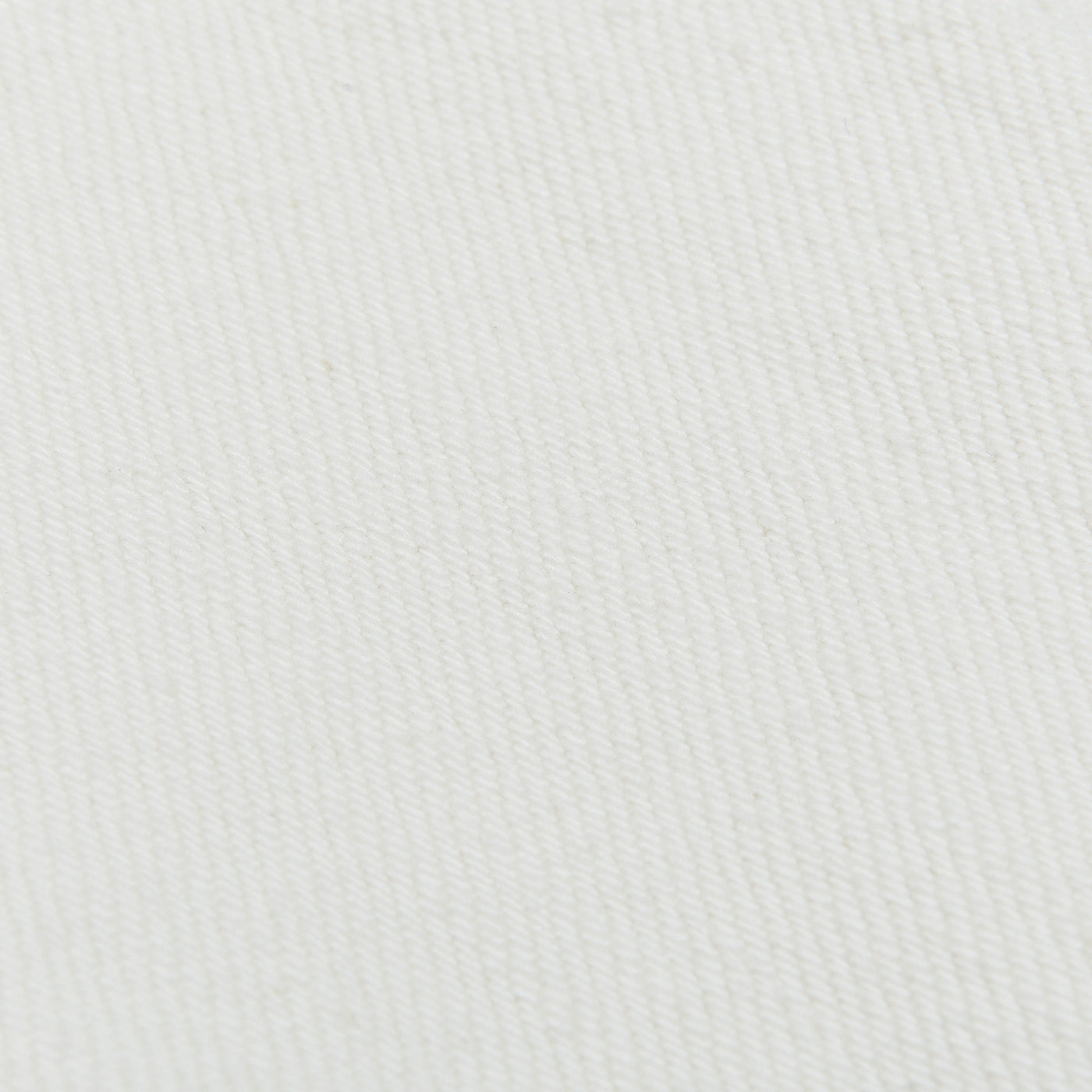 A close up image of white C.O.F Studio Ecru Stone Washed Kuroki Cotton M7 Jeans fabric.