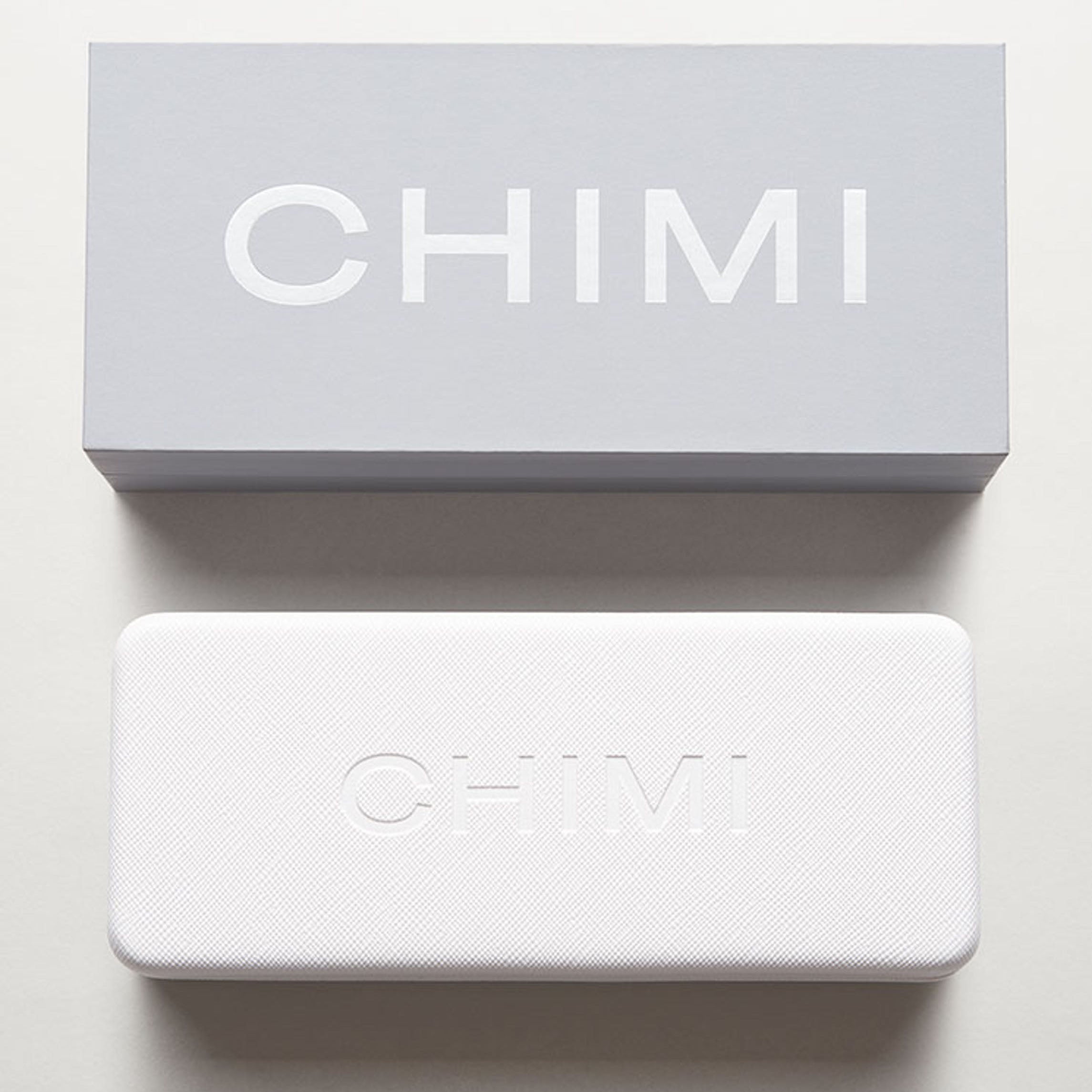 A handcrafted white box with the word Steel Aviator Green Lenses Sunglasses 56mm on it, by Chimi.